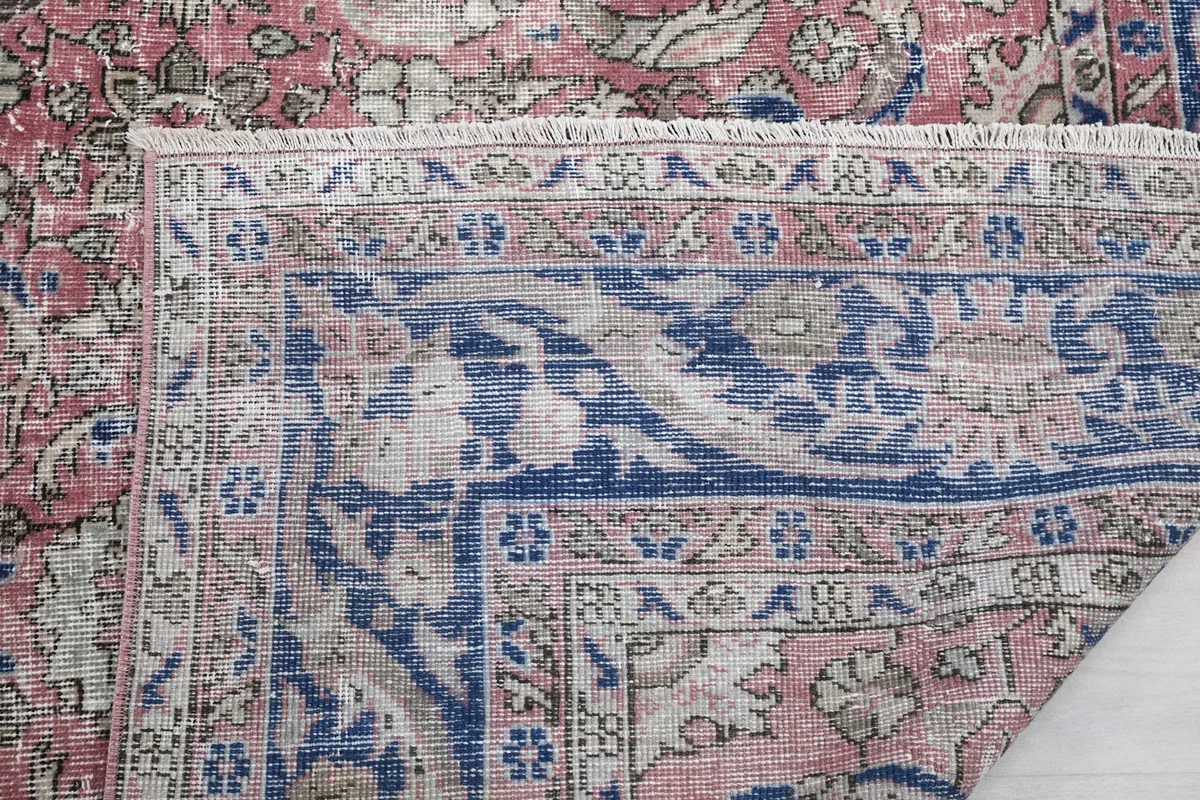 Close-up of the rug's reverse side, showing the hand-knotted construction