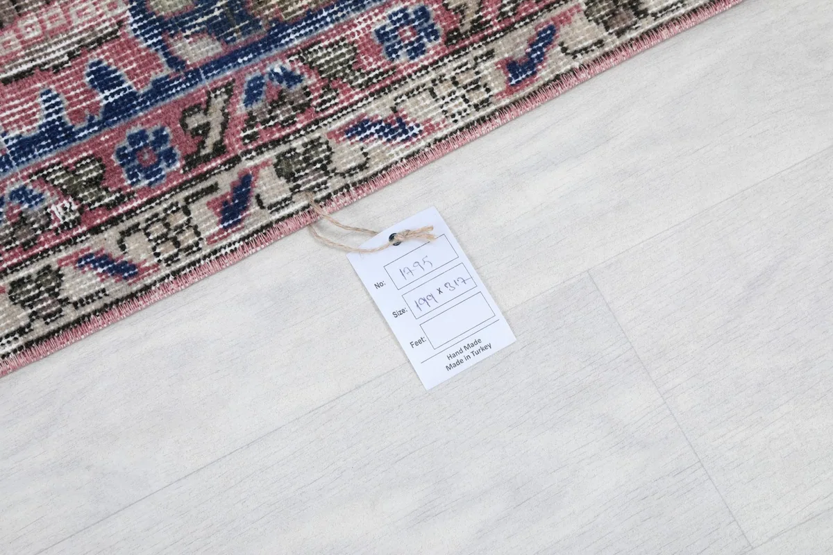 Product tag on the rug, indicating it is hand-made in Turkey