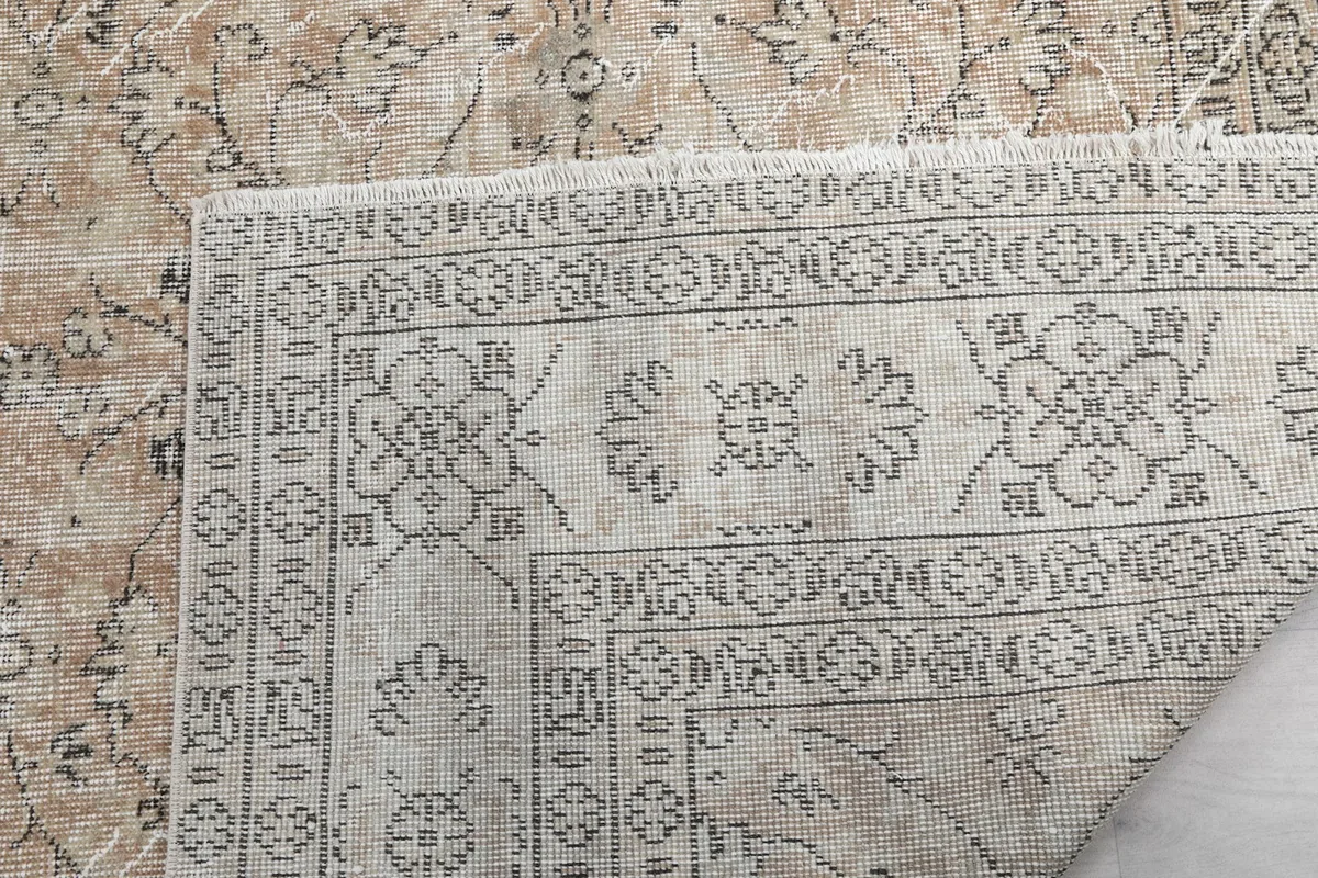 Close-up of the hand-knotted weave and cotton foundation on the back of the rug
