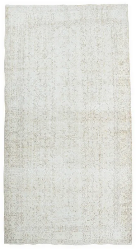 Full overhead view of the beige and ivory vintage Anatolian area rug.