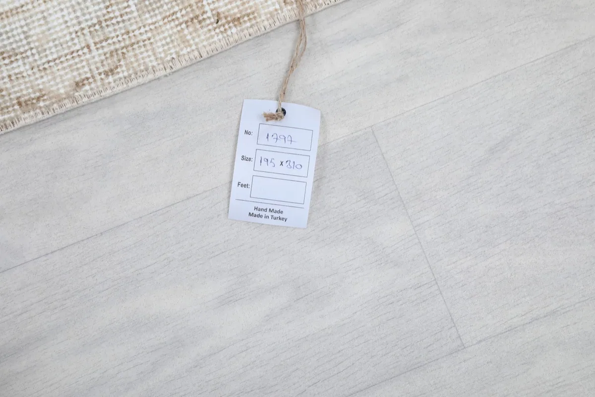 Product tag displaying the rug's size and origin, 'Hand Made in Turkey'.