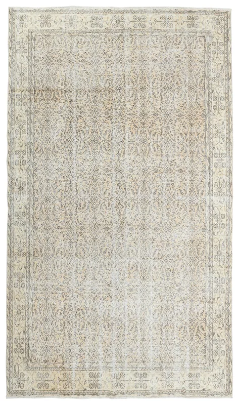 Full top view of the 6'7" x 9'10" ivory and gray vintage Anatolian area rug