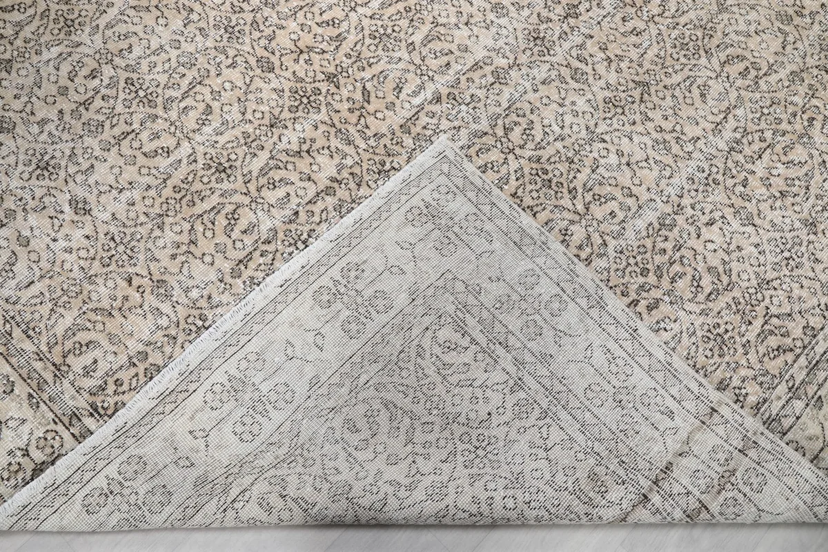 Underside view of the hand-knotted cotton foundation and reverse side of the rug pattern