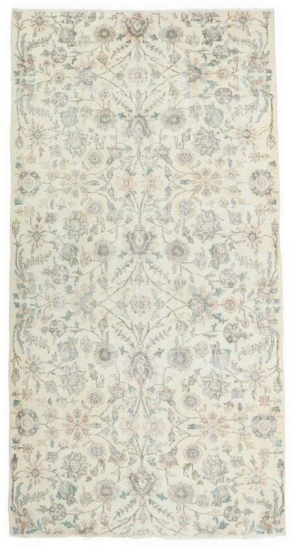 Full overhead view of the 5'7" x 9'2" ivory vintage Anatolian rug with botanical lattice pattern