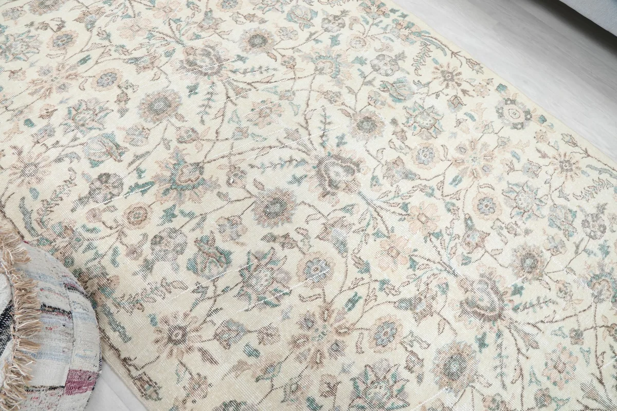 Overhead angle showcasing the full pattern and texture of the vintage Anatolian area rug
