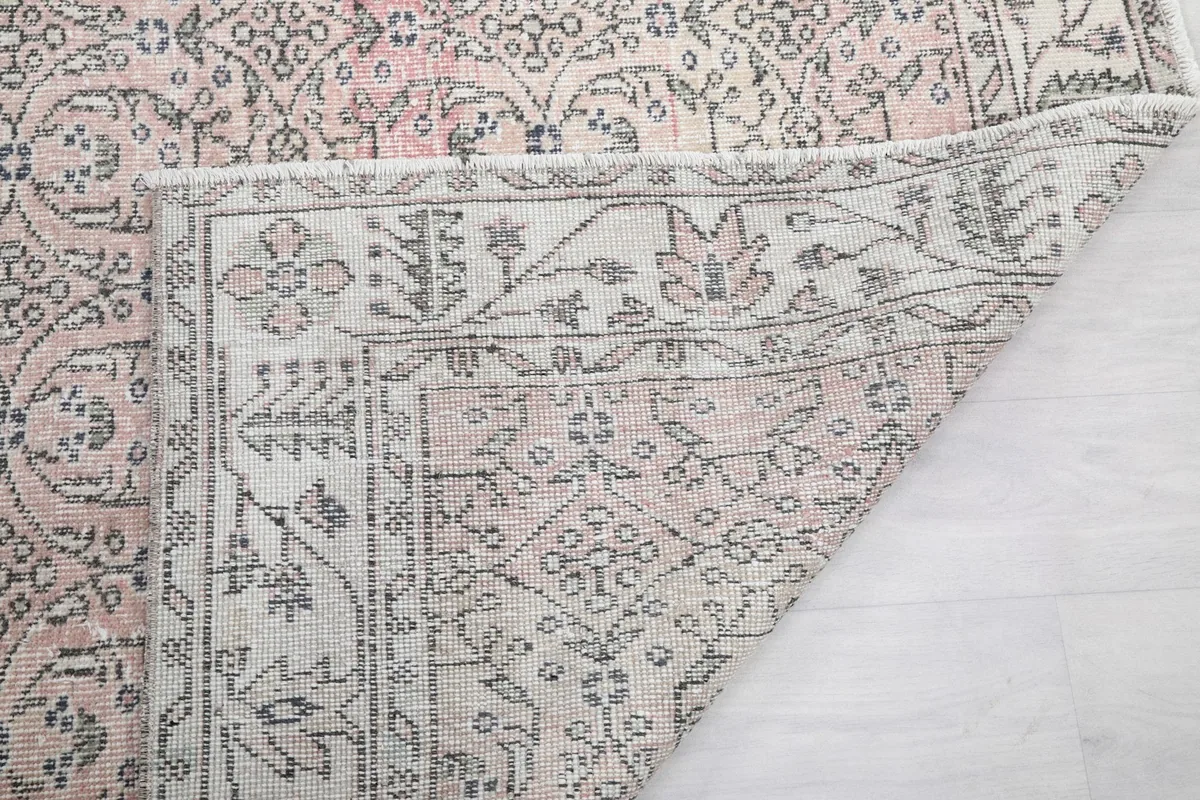 Underside of the rug, showing the hand-knotted cotton foundation