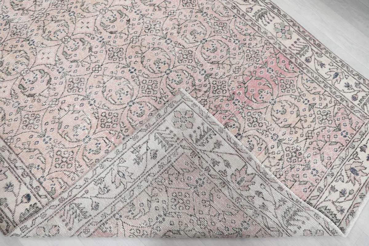 Folded corner of the rug, revealing the thickness and construction
