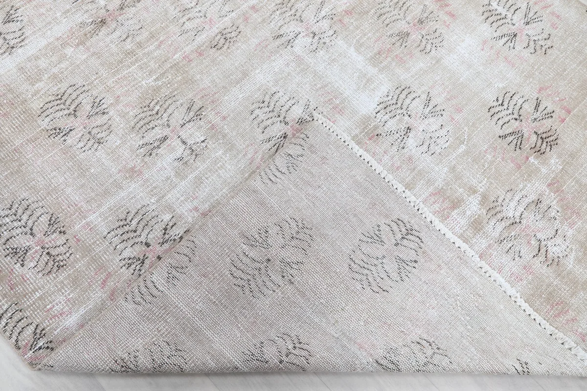 Underside view of the rug, revealing the cotton foundation and hand-knotted construction