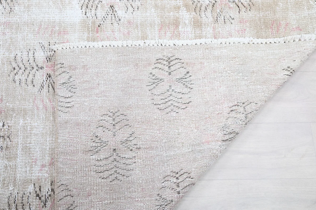 Detailed view of the rug's back, showing the consistent knotting and material