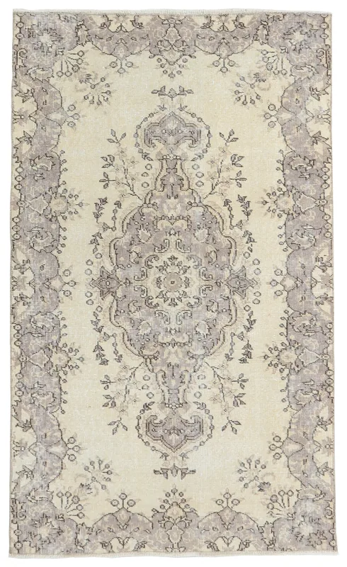Full overhead view of the ivory and gray vintage Anatolian rug