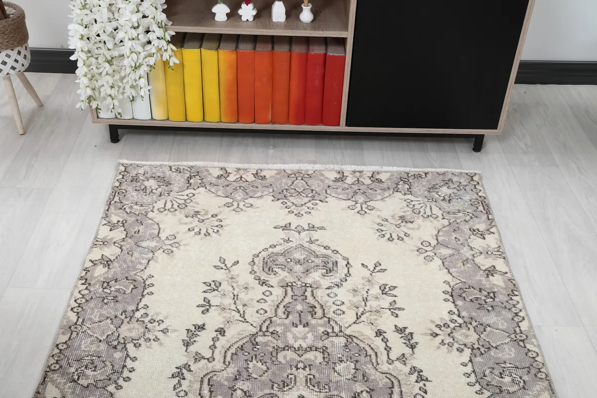 Overhead view of the rug placed in a room, showing its full design and scale