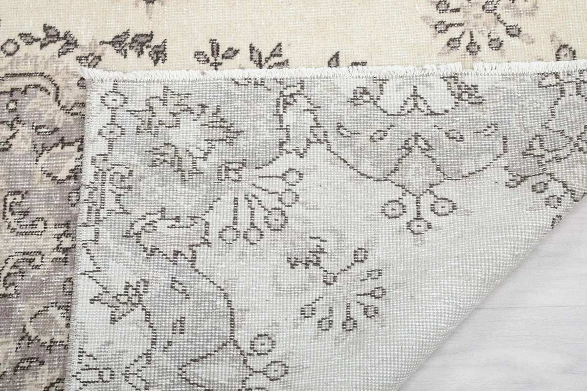 Close-up of the back of the rug, showing the knotting and foundation details