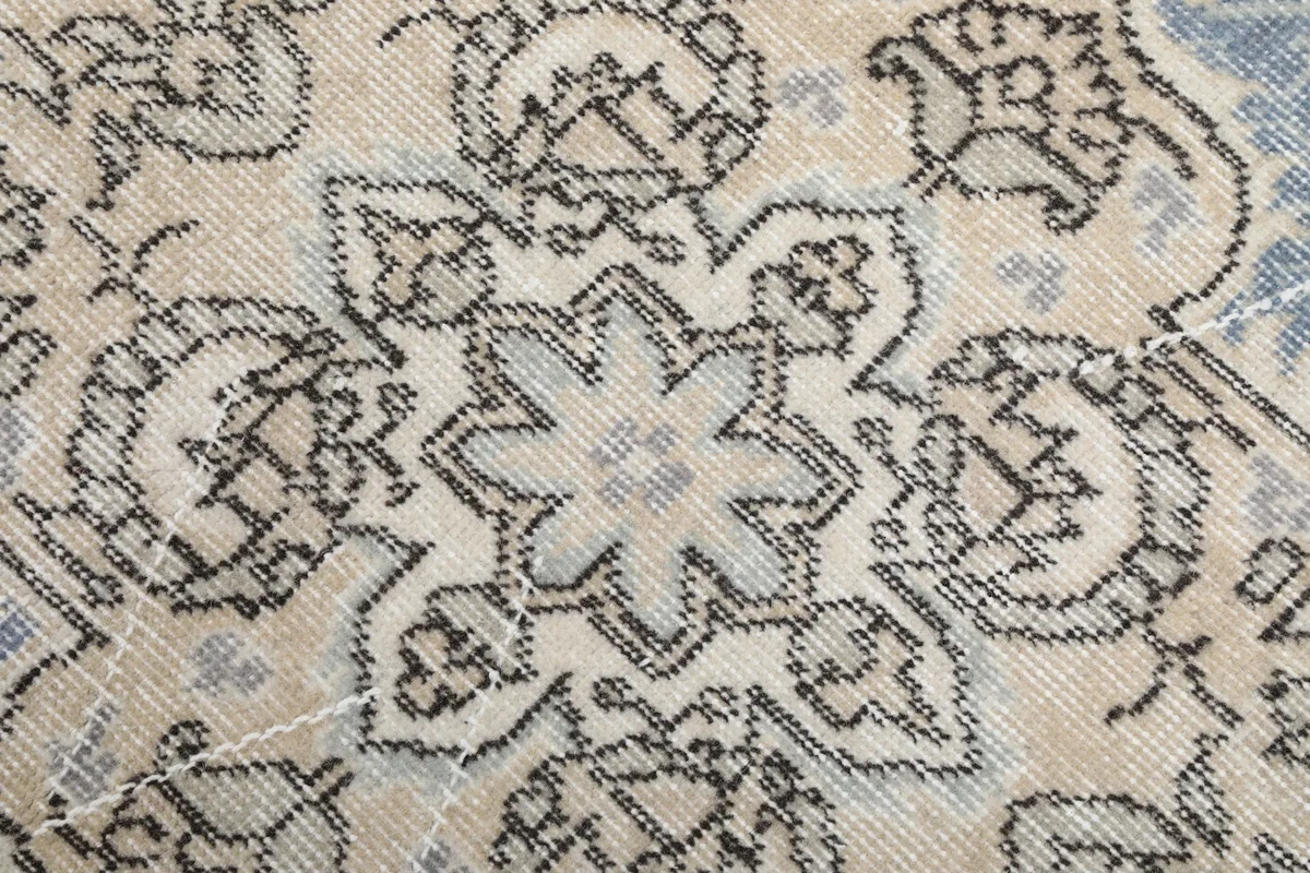 Close-up detail of the intricate star-like motif within the central medallion