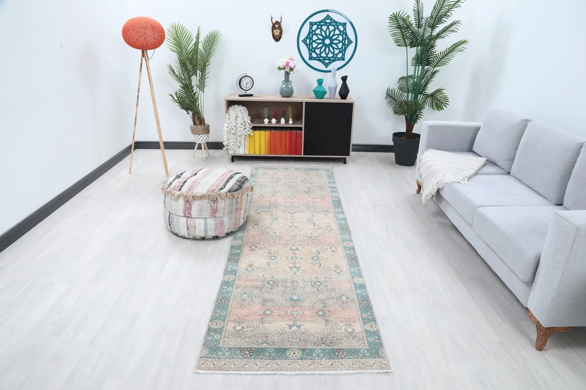 Runner rug displayed in a modern living space, showing its length and colors in context.