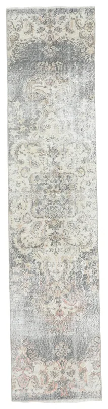 Full overhead view of the 2'2" x 9'7" vintage Anatolian runner with ivory and gray floral patterns