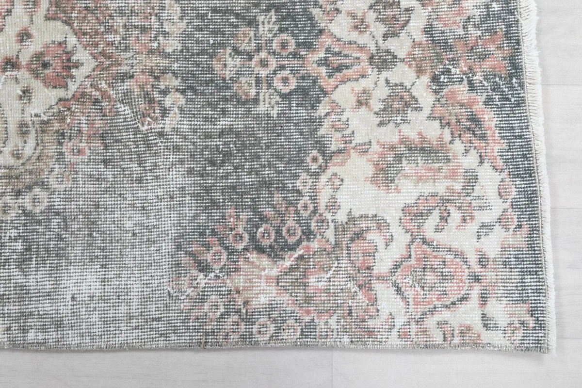 Close-up detail of the runner's patterns, showcasing the gray, ivory, and rose tones