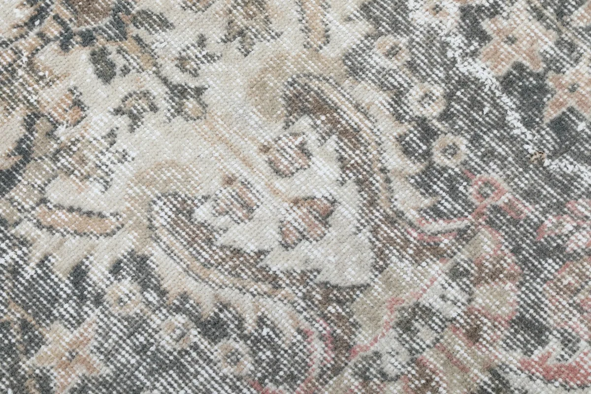Close-up of the low wool pile and intricate hand-knotted details