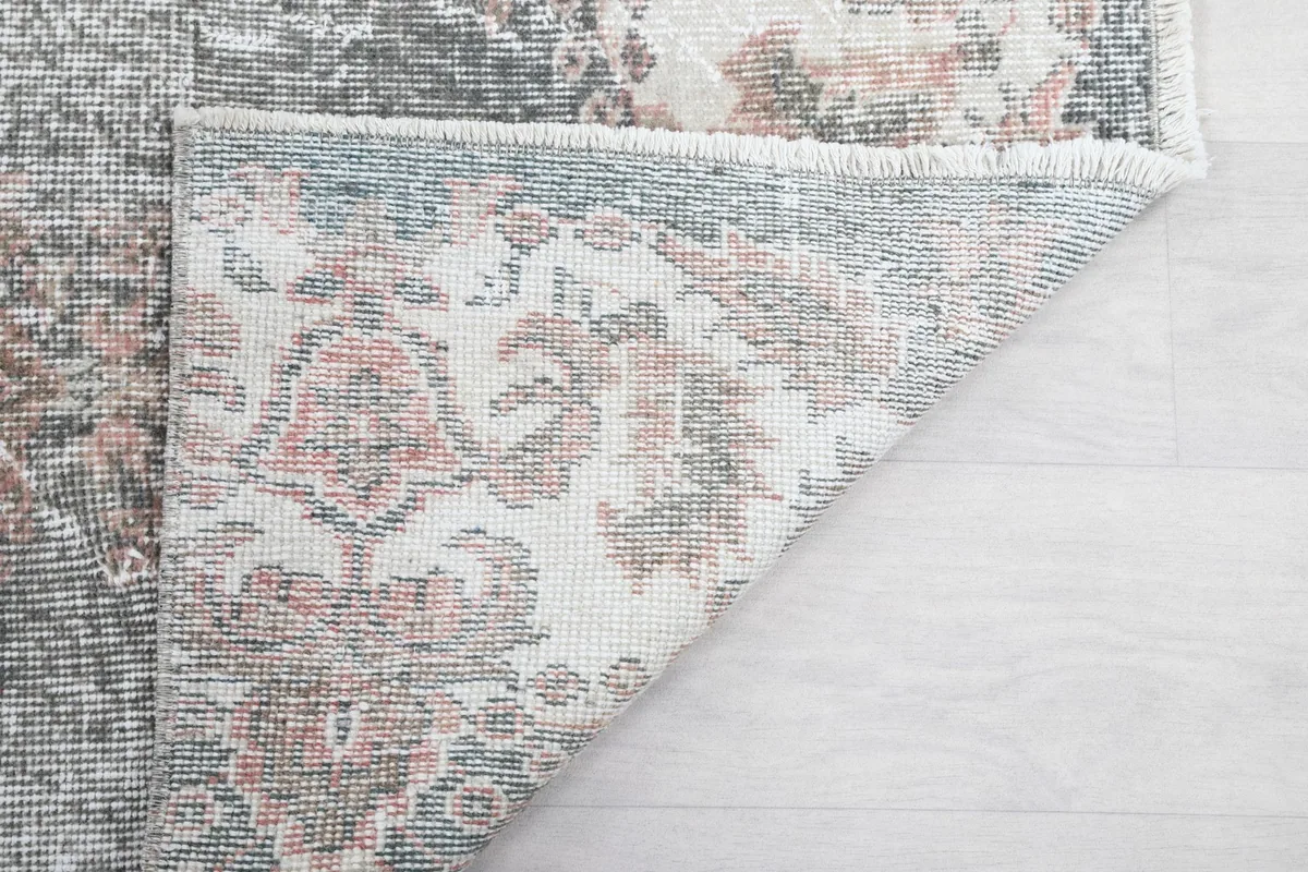 Another view of the folded corner, showing the craftsmanship of the rug's reverse
