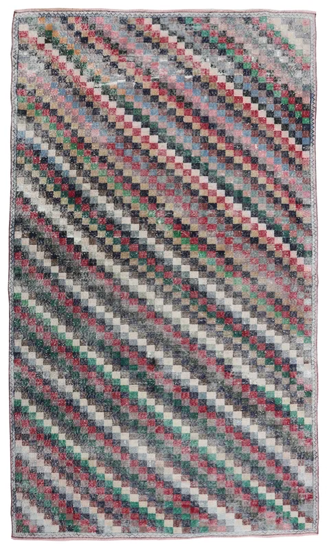 Full top view of the multicolor checkered vintage Anatolian area rug on a white background