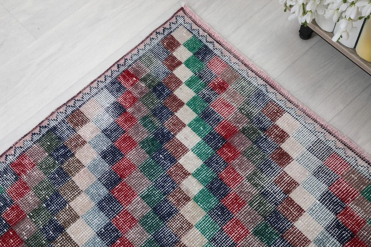 Close-up of the rug's border and the intricate geometric pattern of the squares