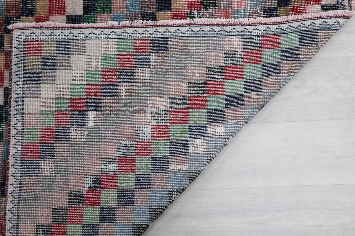 Underside view of a folded corner, showcasing the construction and colors from the back