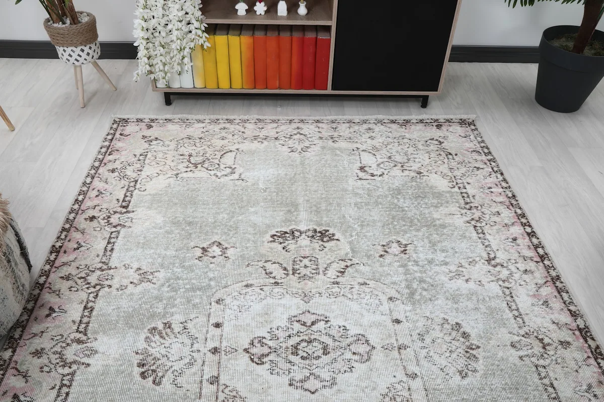 Overhead view of the vintage rug in a room, highlighting its placement near furniture