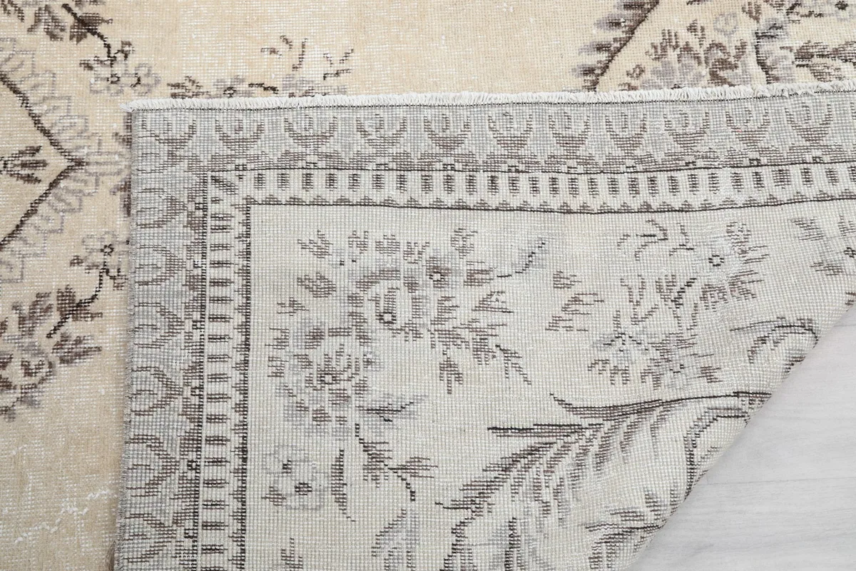 Close-up of the rug's back and edge, showing the tight knotting