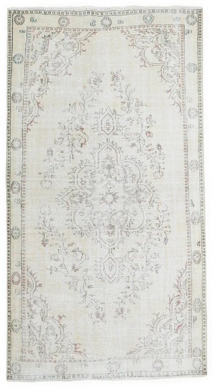 Full top view of the 5'9" x 9'1" vintage Anatolian rug with ivory field and rose medallion