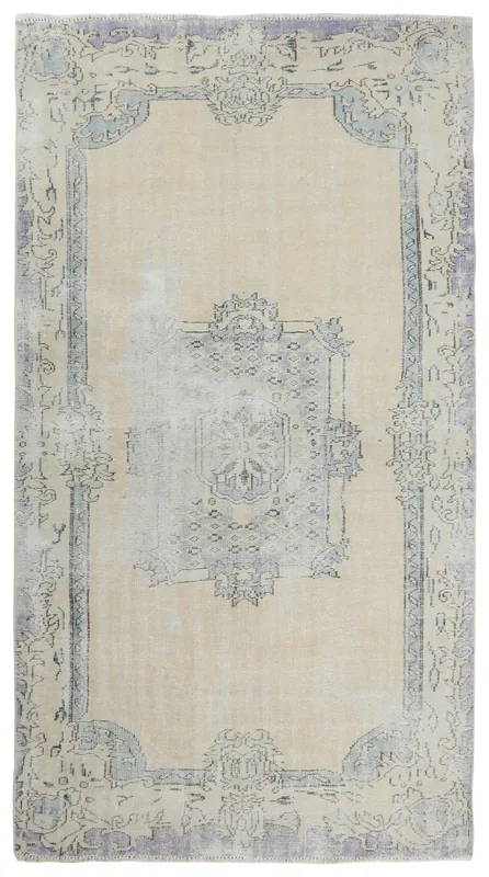 Full top view of the vintage 6'4" x 9'9" beige Anatolian rug on a white background