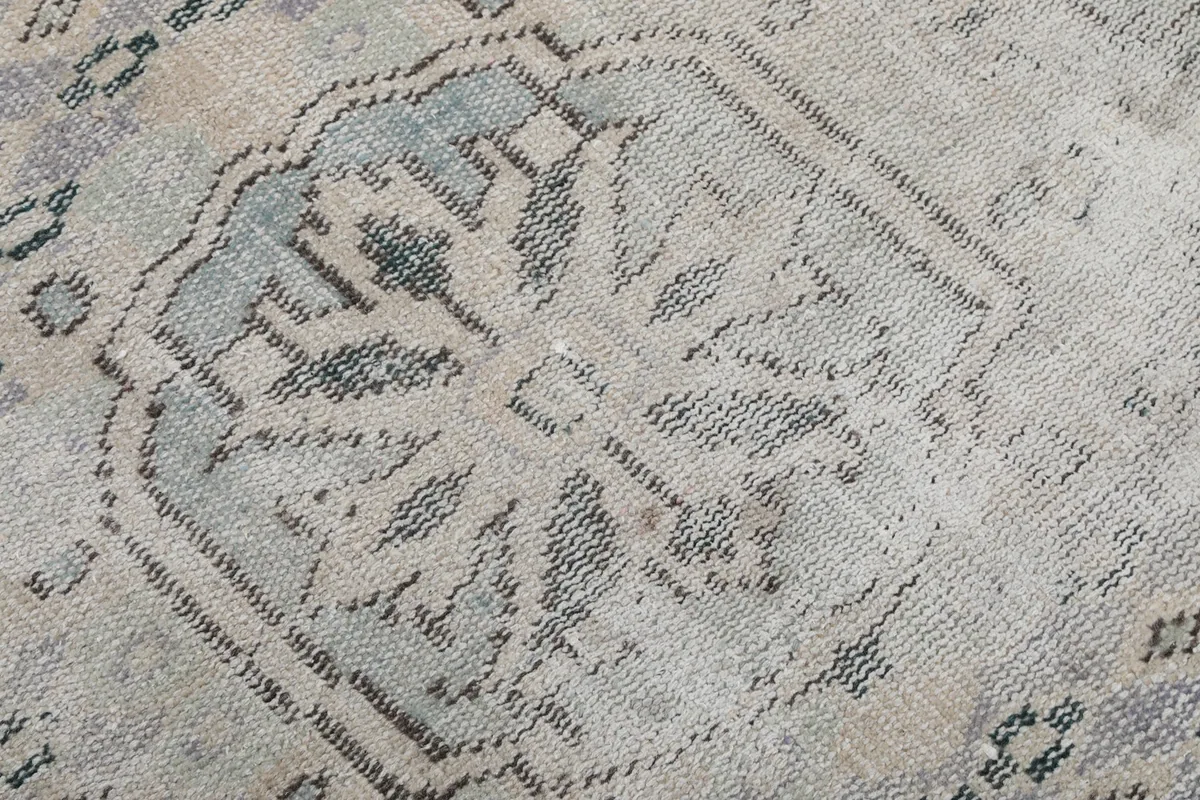 Close-up showing the intricate design of the central medallion and wool pile