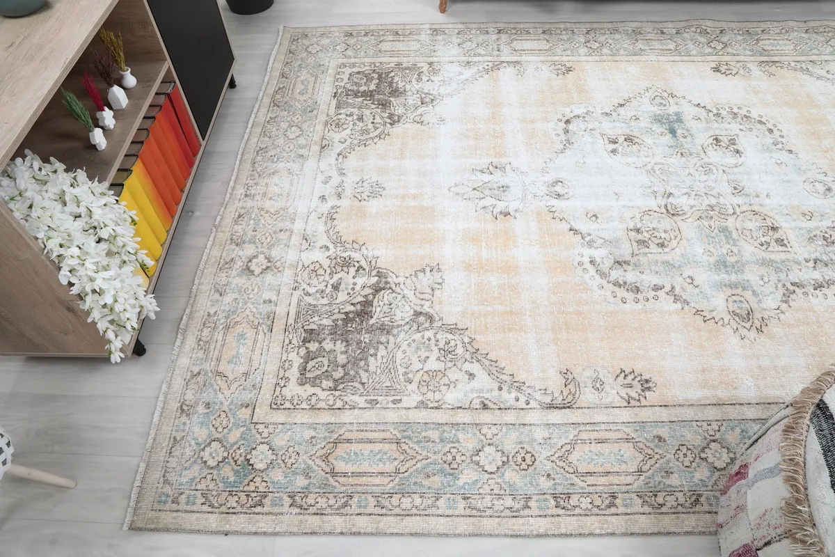 Angled view from above, capturing the rug's overall pattern and colors in a room