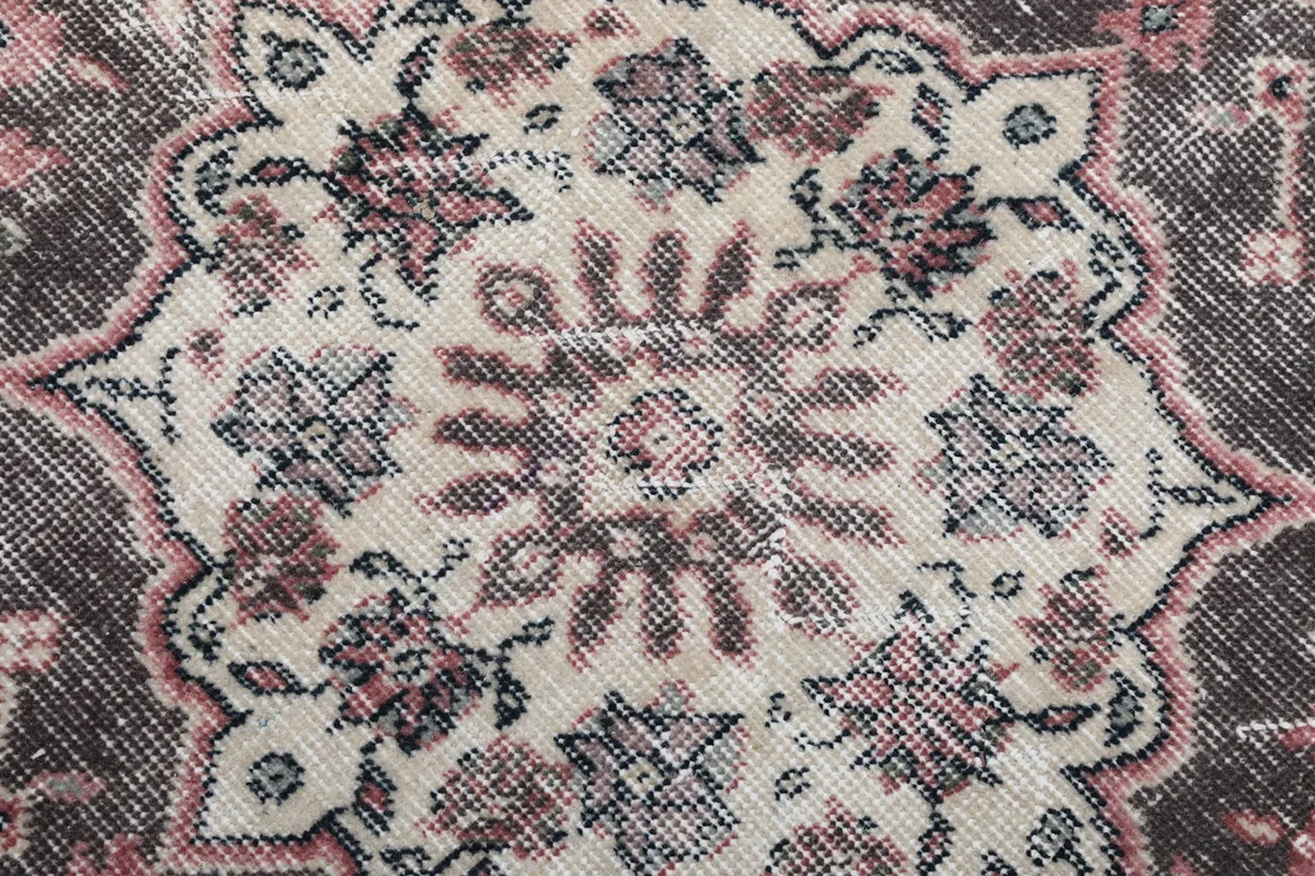 Very close-up of the low wool pile, showing knot detail and natural wear