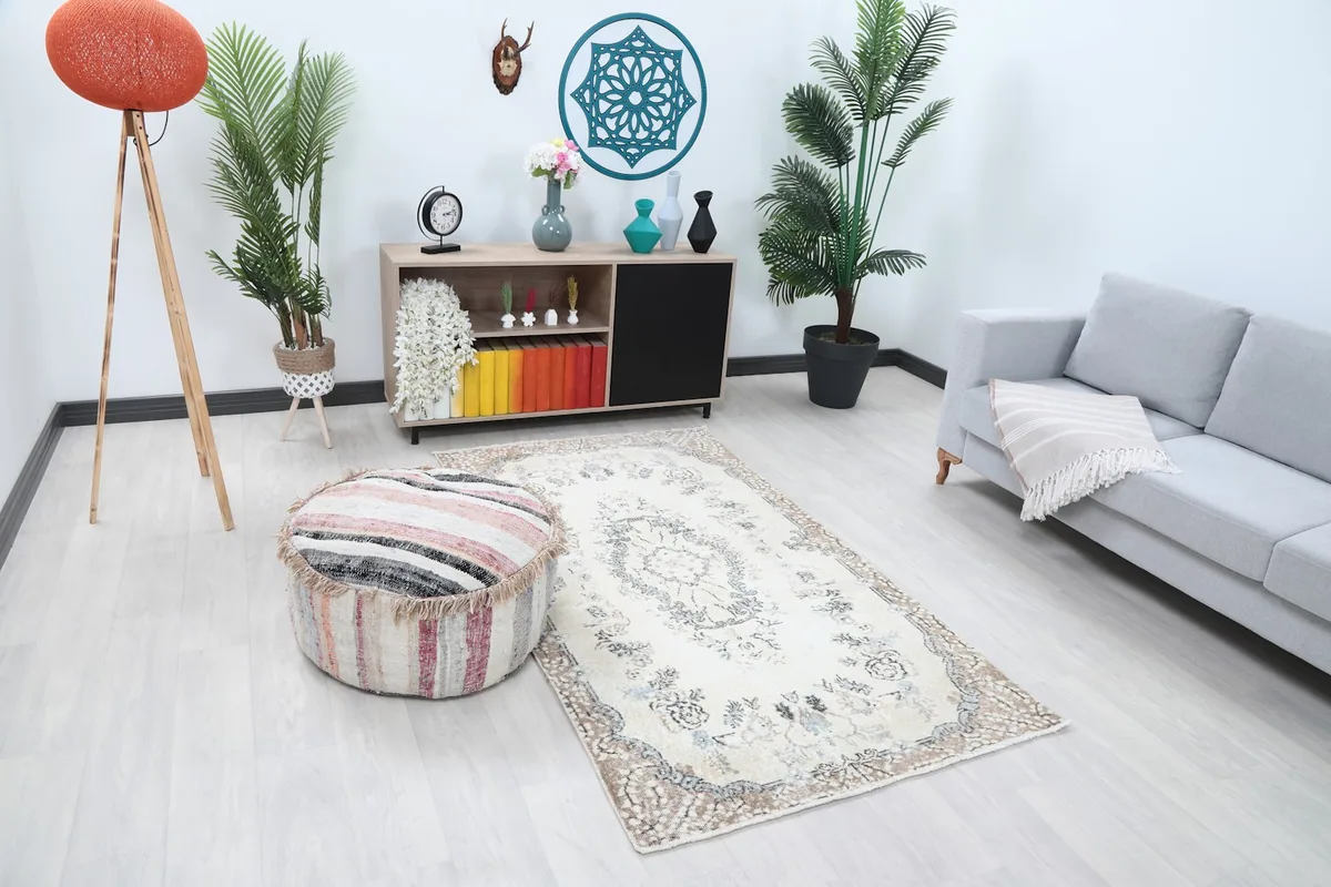 Overhead view of the ivory floral medallion rug placed in a modern living room