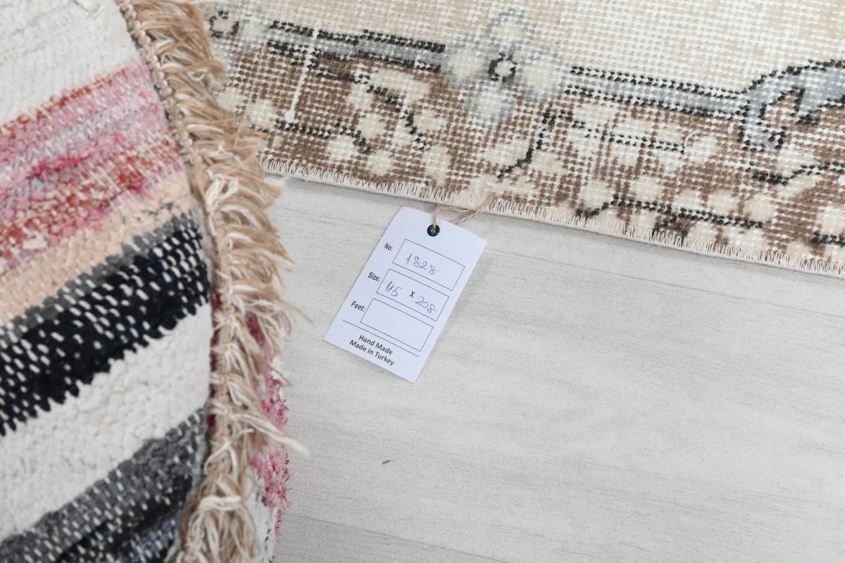 Tag attached to the rug, indicating product information and origin