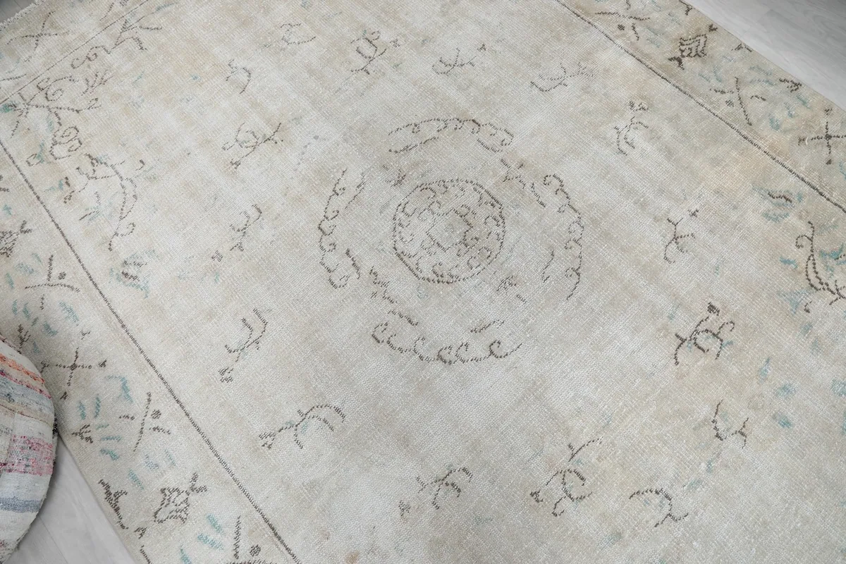 Overhead angle view capturing the overall design and distressed texture of the rug