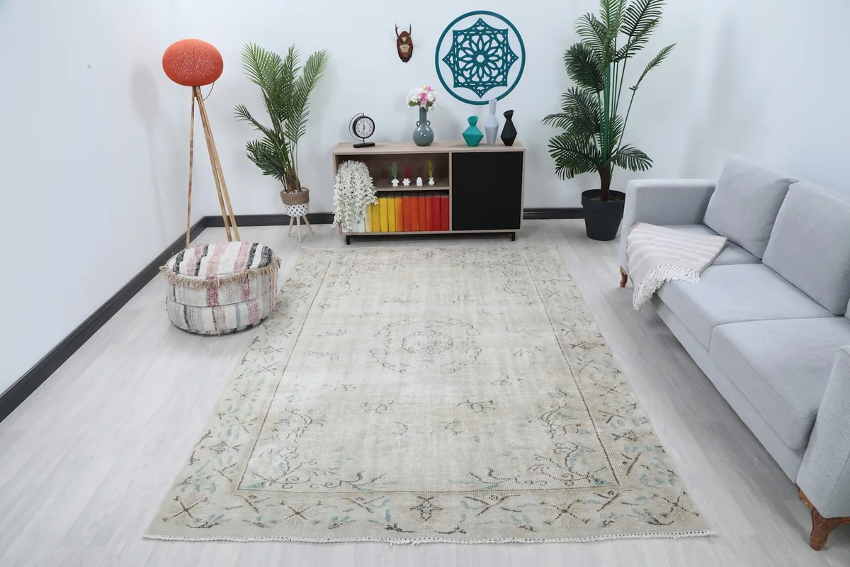 Ivory floral medallion rug in a living room setting, showcasing its medium size