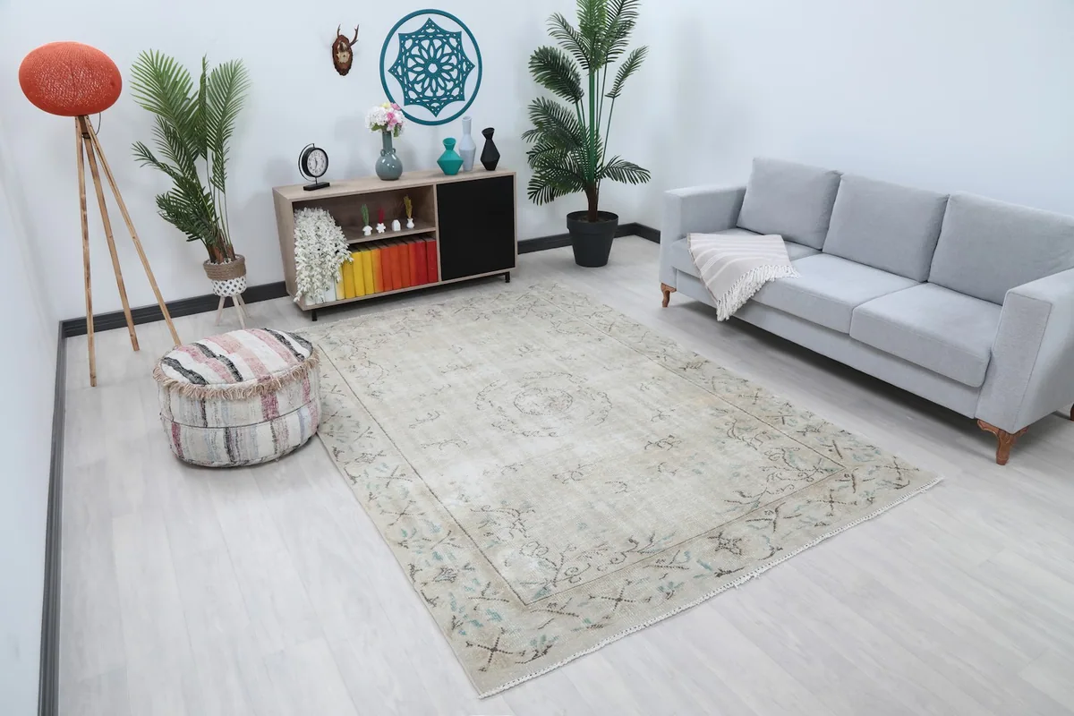 Angle view of the ivory vintage rug in a modern living space with light-colored furniture