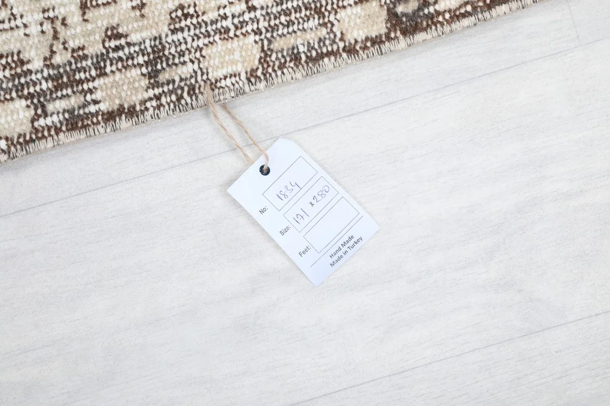 Tag showing the rug's dimensions and origin, confirming its Anatolian vintage heritage