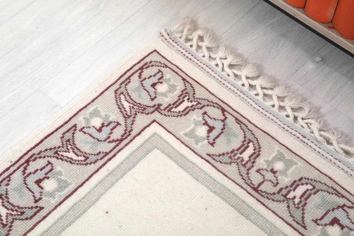 Detailed corner view of the runner, emphasizing the hand-knotted craftsmanship and fringe.