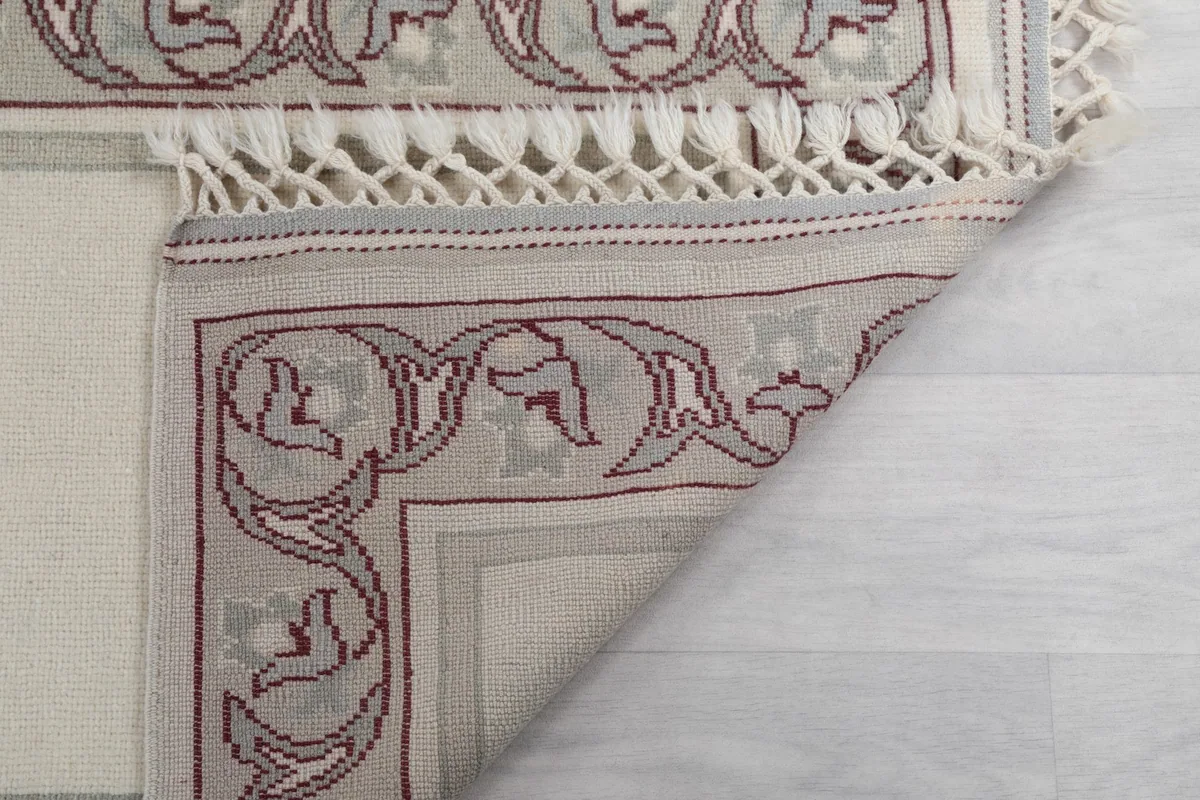 Underside of the runner, revealing the hand-knotted construction and cotton foundation.