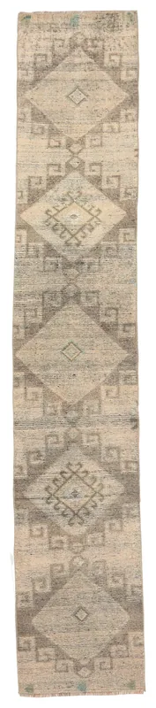 Full overhead view of the 1'11" x 10'11" tan and gray tribal geometric runner.