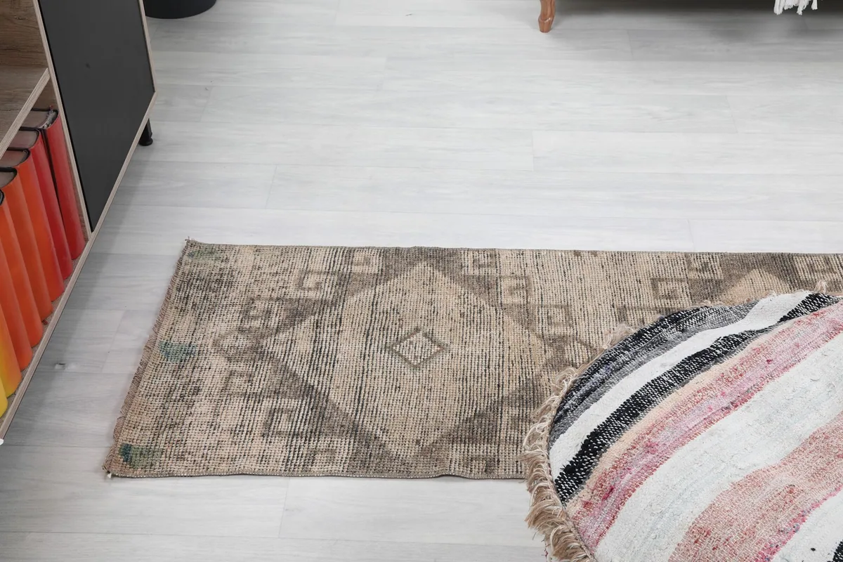 Angled view of the runner on a light floor, showing its length and pattern.