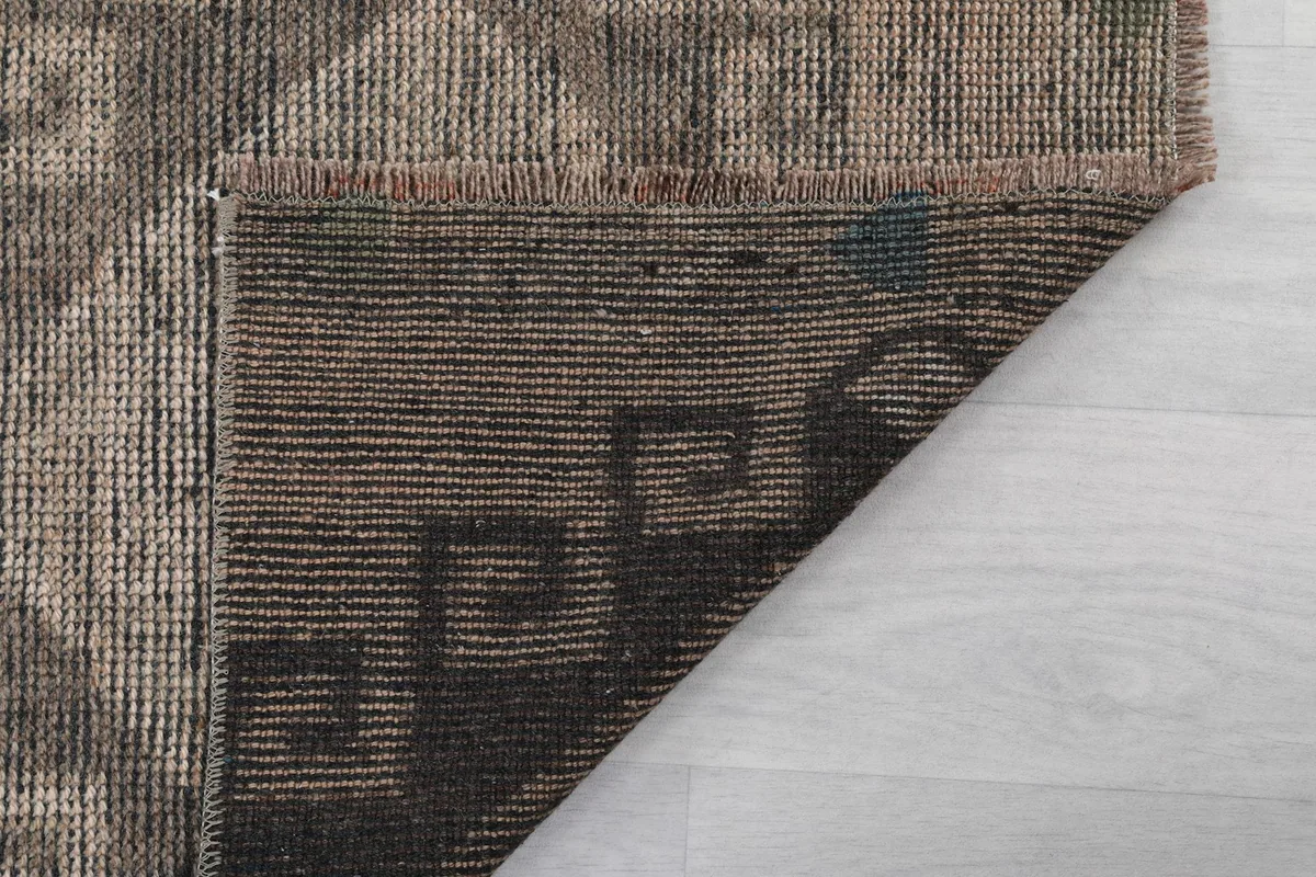 View of the back of the rug, showcasing the tight weave and craftsmanship.