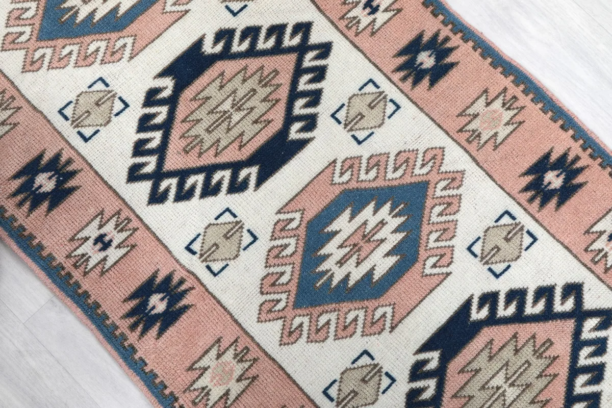 Close-up of the central ivory field and navy/blue geometric patterns