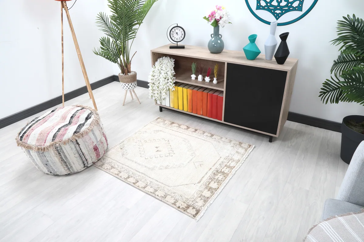 Cream Tribal Medallion Rug in a wider room view, showing its scale next to furniture
