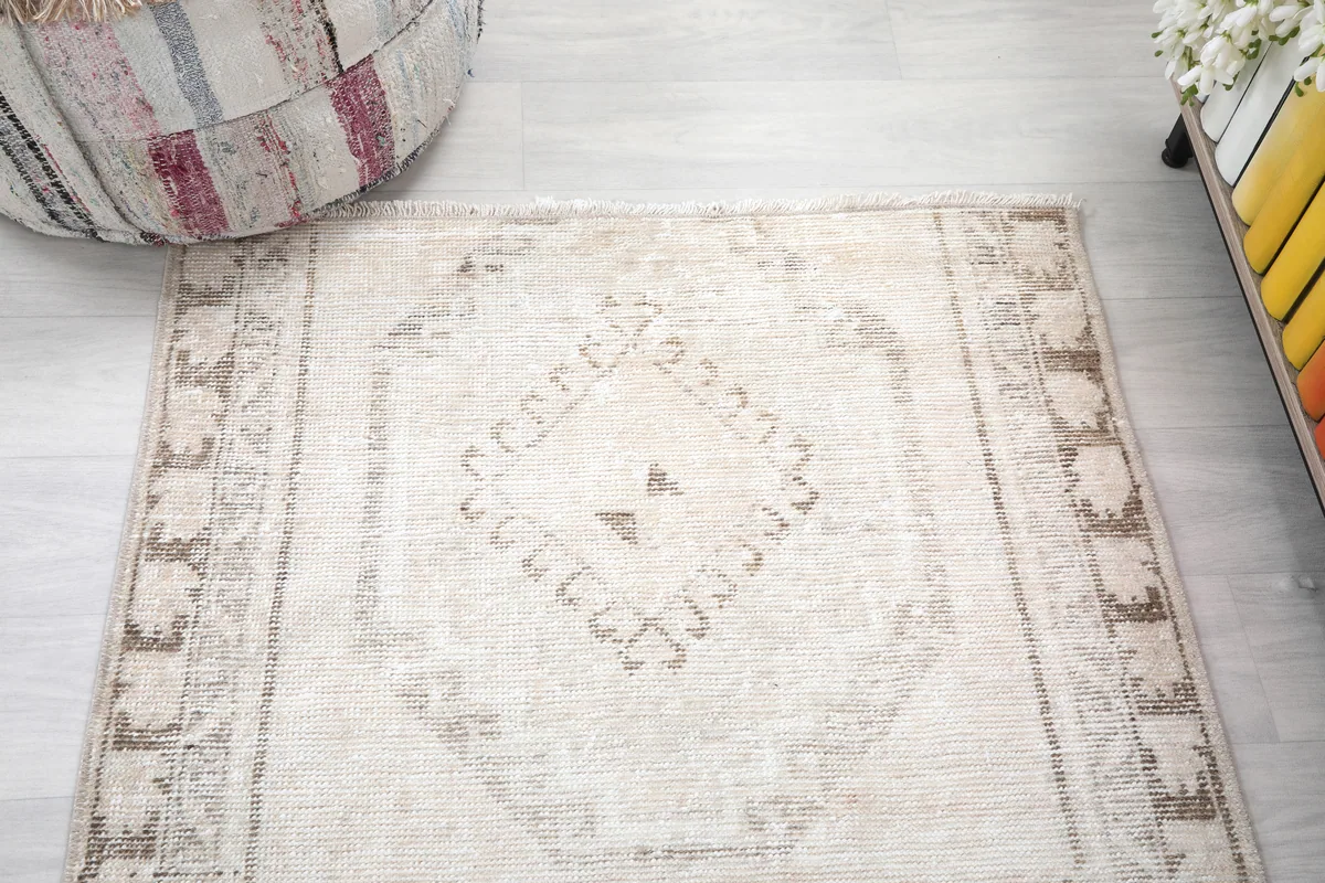 Overhead close-up of the Cream Tribal Medallion Rug's central geometric medallion