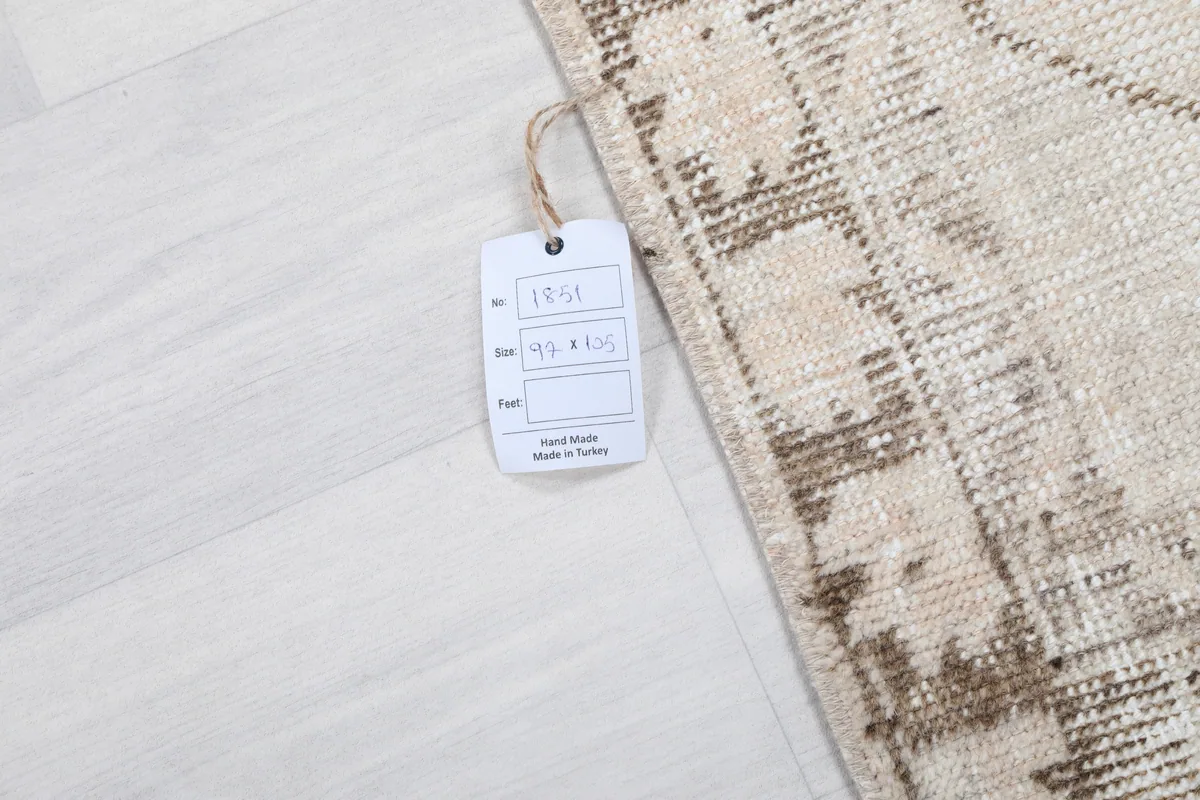 Product tag on the Cream Tribal Medallion Rug, displaying size and origin information