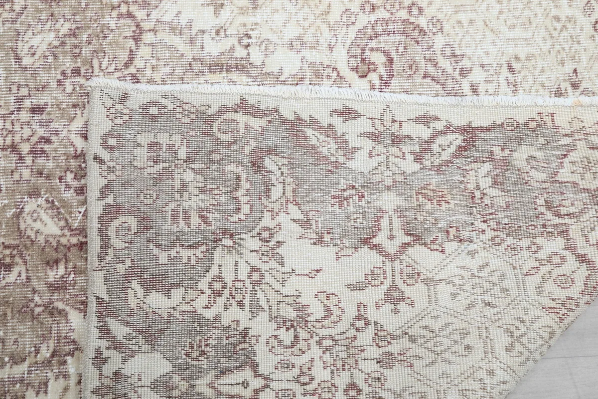 Close-up of the back of the rug, showing the knotting and foundation