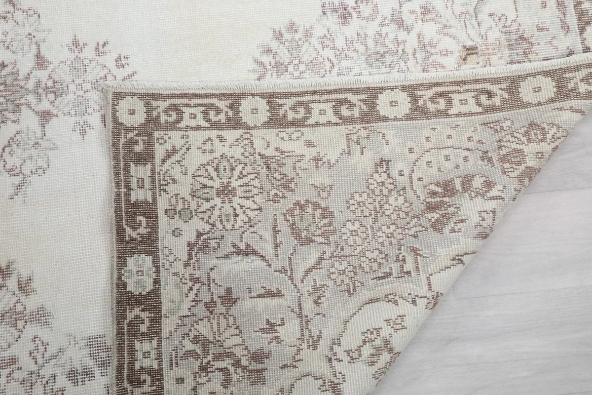 Detailed view of the rug's underside and knotting technique, showing the quality craftsmanship