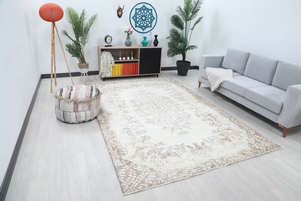Angle view of the ivory and beige vintage rug in a modern living space
